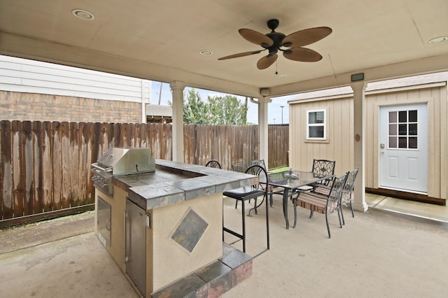 1202 Fairlane Sq, Channelview, TX 77530 - view of patio / terrace featuring an outdoor kitchen, outdoor dining space, and a ceiling fan