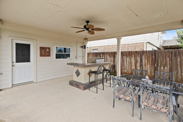 1202 Fairlane Sq, Channelview, TX 77530 - view of patio with ceiling fan, exterior kitchen, and outdoor dining space