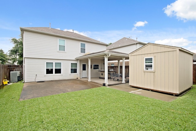1202 Fairlane Sq, Channelview, TX 77530 - back of property with a patio area and a storage unit