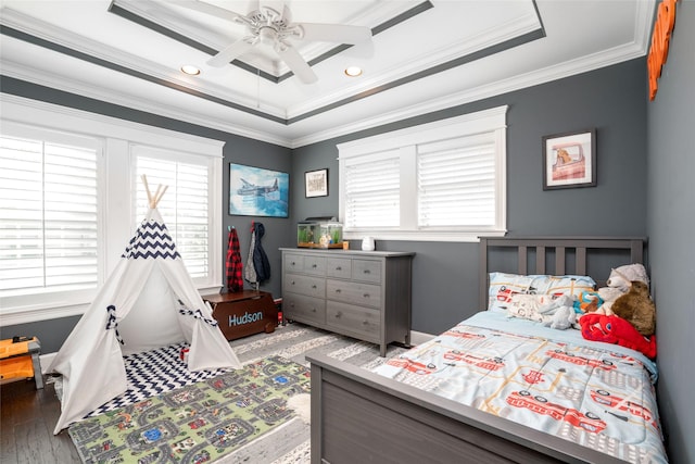 1719 Guese Rd, Houston, TX 77008 - bedroom with multiple windows, a tray ceiling, ornamental molding, wood finished floors, and a ceiling fan