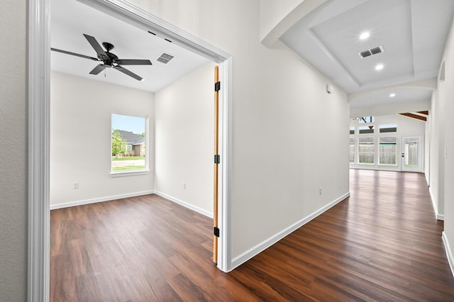 101 Callie St, Smithville, TX 78957 - hall with healthy amount of natural light, dark wood-type flooring, recessed lighting, and arched walkways