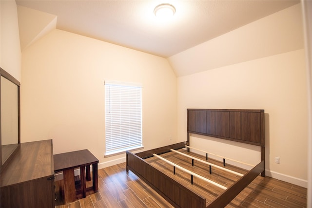 19211 Belmont Stakes Way, Tomball, TX 77377 - bedroom with vaulted ceiling and wood finished floors