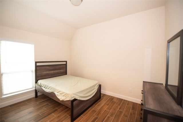 19211 Belmont Stakes Way, Tomball, TX 77377 - bedroom with dark wood-style flooring and vaulted ceiling