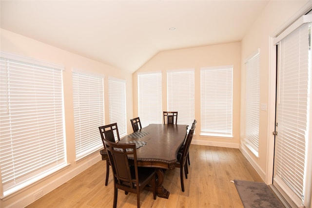 19211 Belmont Stakes Way, Tomball, TX 77377 - dining space with light wood-type flooring and vaulted ceiling