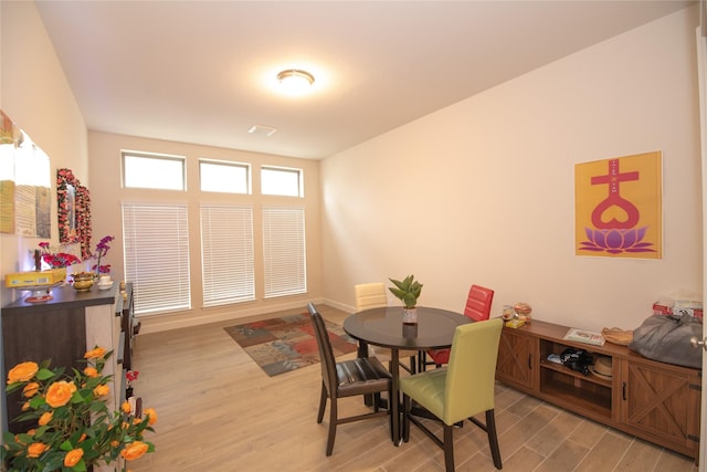 19211 Belmont Stakes Way, Tomball, TX 77377 - dining area featuring light wood finished floors and baseboards