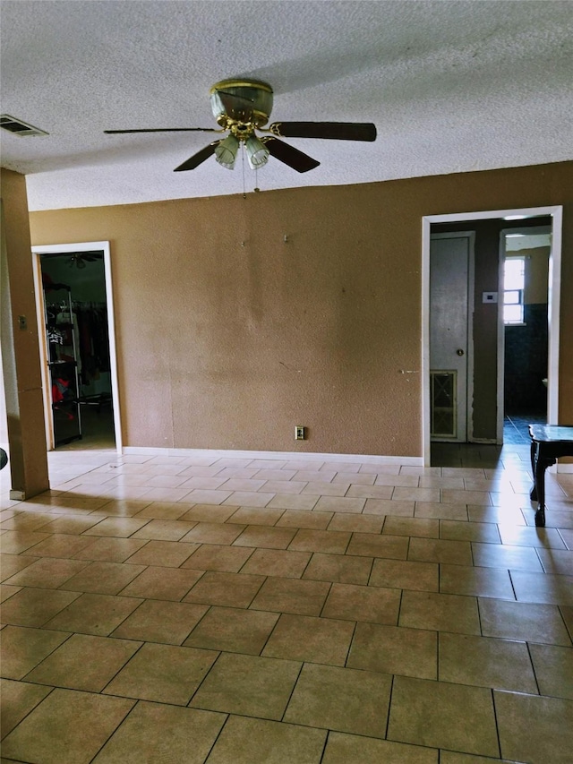 700 W 19th St, Port Arthur, TX 77640 - empty room featuring a ceiling fan and a textured ceiling
