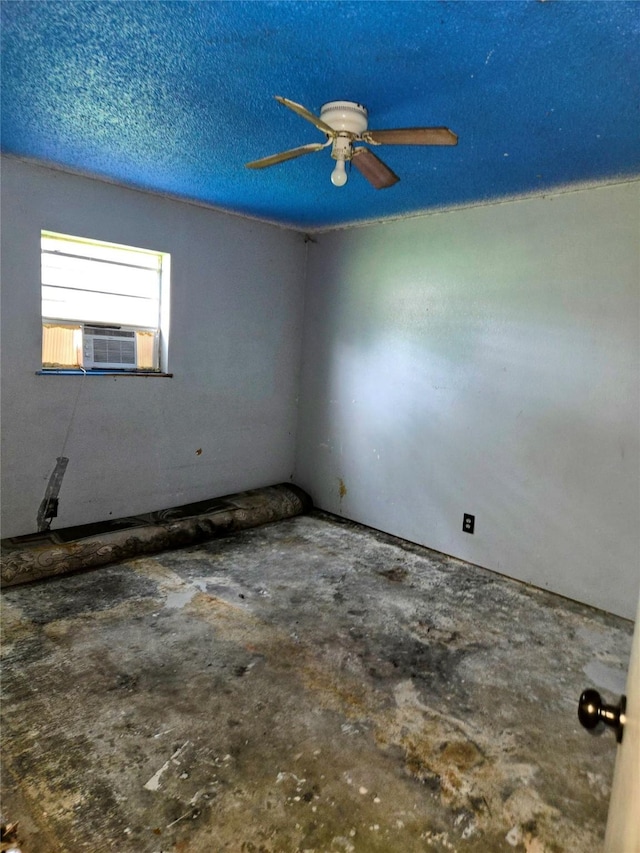 700 W 19th St, Port Arthur, TX 77640 - empty room with cooling unit, concrete floors, and ceiling fan