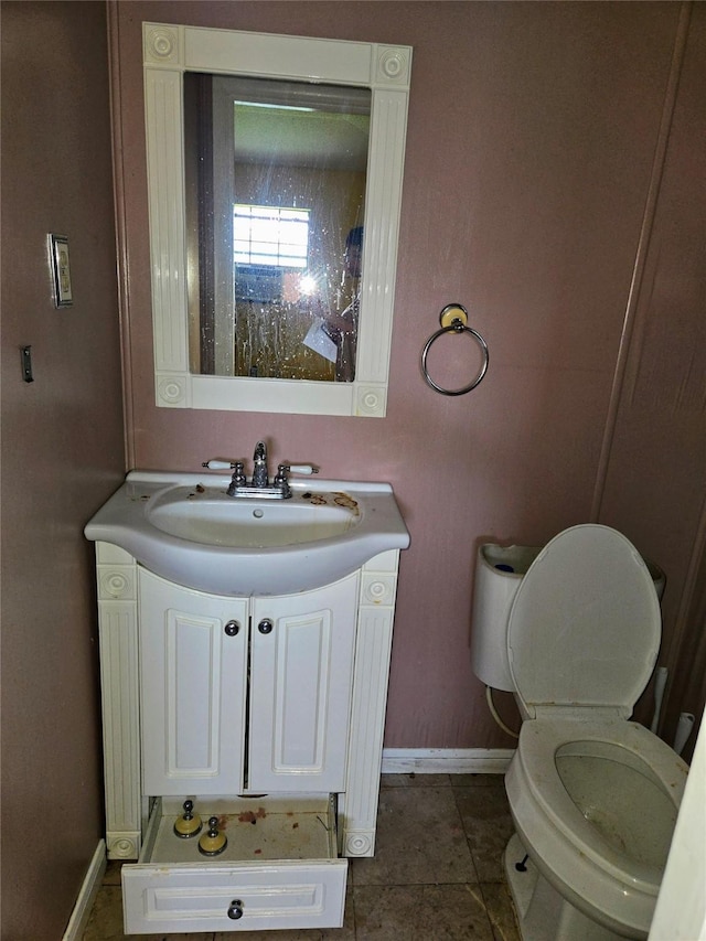 700 W 19th St, Port Arthur, TX 77640 - bathroom with vanity and tile patterned flooring