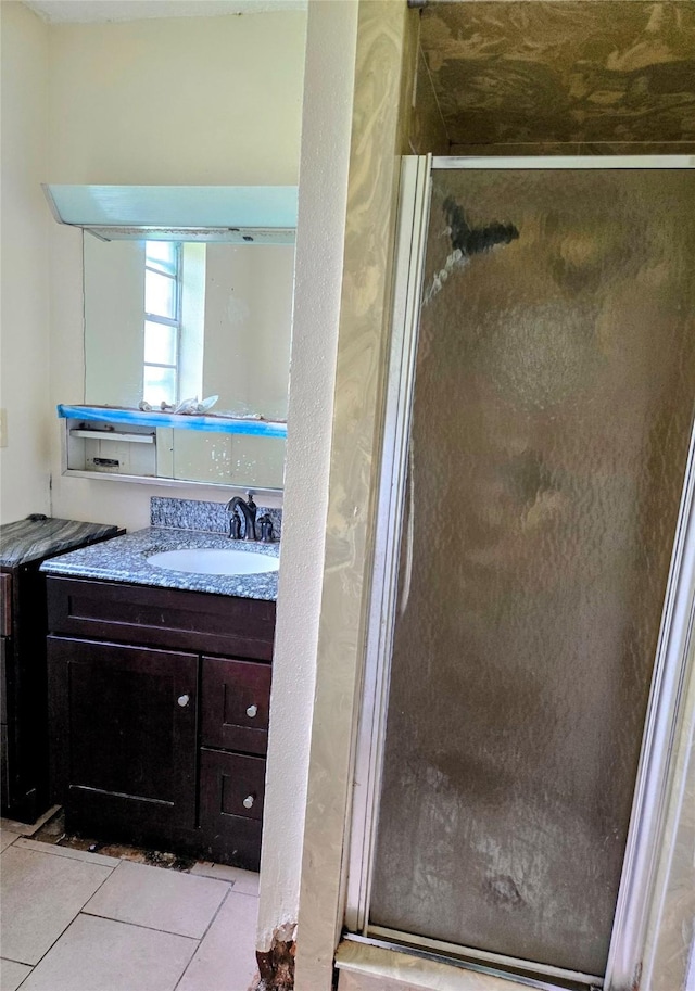 700 W 19th St, Port Arthur, TX 77640 - full bath with vanity, a shower stall, and tile patterned floors