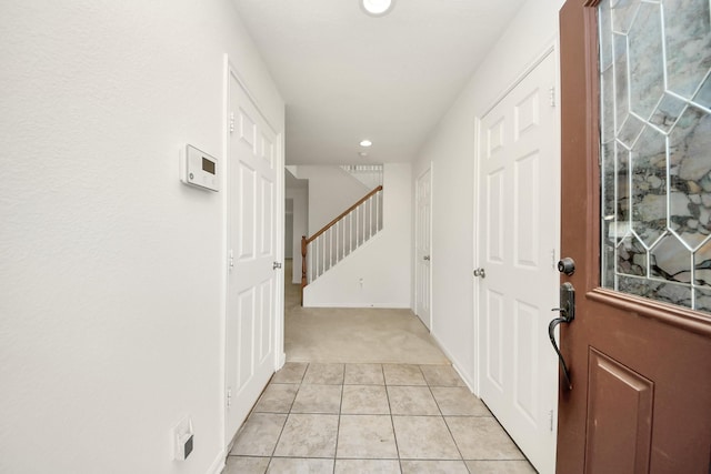2702 Urban Glen Ct, Houston, TX 77038 - foyer with light carpet, recessed lighting, light tile patterned floors, and stairway