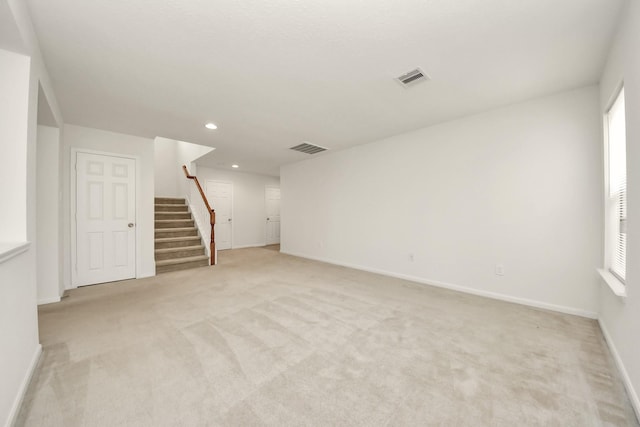 2702 Urban Glen Ct, Houston, TX 77038 - unfurnished room with stairs, light carpet, recessed lighting, and plenty of natural light