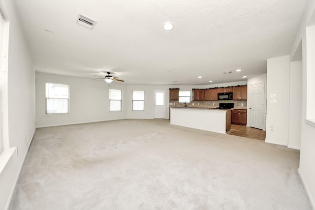 2702 Urban Glen Ct, Houston, TX 77038 - unfurnished living room with recessed lighting, a ceiling fan, and light carpet