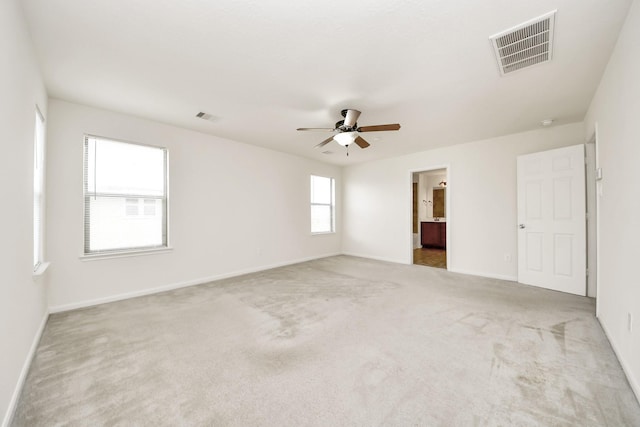 2702 Urban Glen Ct, Houston, TX 77038 - unfurnished bedroom featuring carpet floors, ceiling fan, and ensuite bathroom
