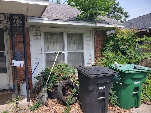 10221 Bretton Dr, Houston, TX 77016 - exterior view of brick siding and a shingled roof