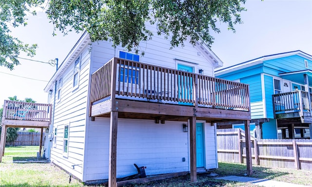 6201 Heards Ln, Galveston, TX 77551 - rear view of property featuring a garage and a wooden deck