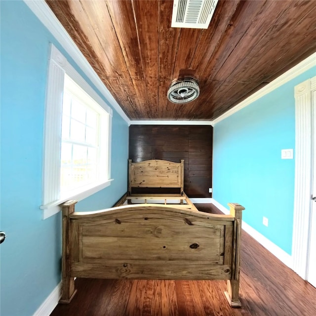 6201 Heards Ln, Galveston, TX 77551 - bedroom with wood ceiling, crown molding, and wood finished floors