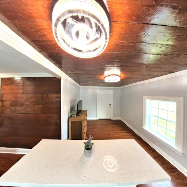 6201 Heards Ln, Galveston, TX 77551 - dining room featuring wooden ceiling, crown molding, and dark wood finished floors