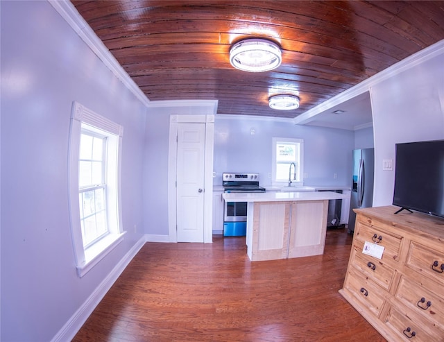 6201 Heards Ln, Galveston, TX 77551 - kitchen with stainless steel appliances, wood ceiling, light countertops, ornamental molding, and a kitchen island