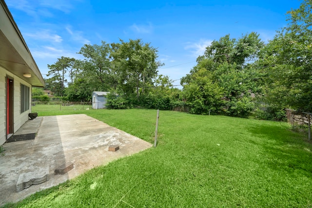 7421 Parker Rd, Houston, TX 77016 - fenced backyard featuring a patio area and an outbuilding