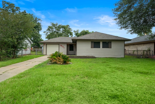 7421 Parker Rd, Houston, TX 77016 - ranch-style home featuring concrete driveway, a garage, and a shingled roof