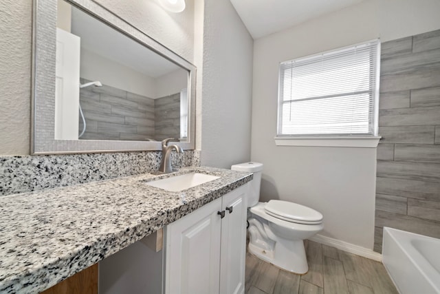 7421 Parker Rd, Houston, TX 77016 - full bath featuring vanity and wood finished floors