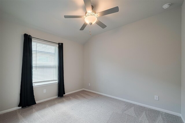 10005 Hermann Trce, Texas City, TX 77591 - empty room with light colored carpet, a ceiling fan, a smoke detector, and vaulted ceiling