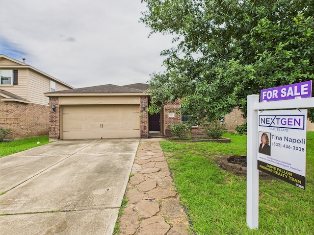 9439 Amethyst Glen Dr, Rosharon, TX 77583 - view of front of home with brick siding, concrete driveway, and a front yard