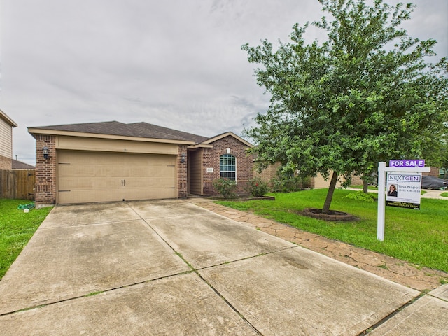 9439 Amethyst Glen Dr, Rosharon, TX 77583 - view of front of home with brick siding, a garage, a front lawn, and driveway