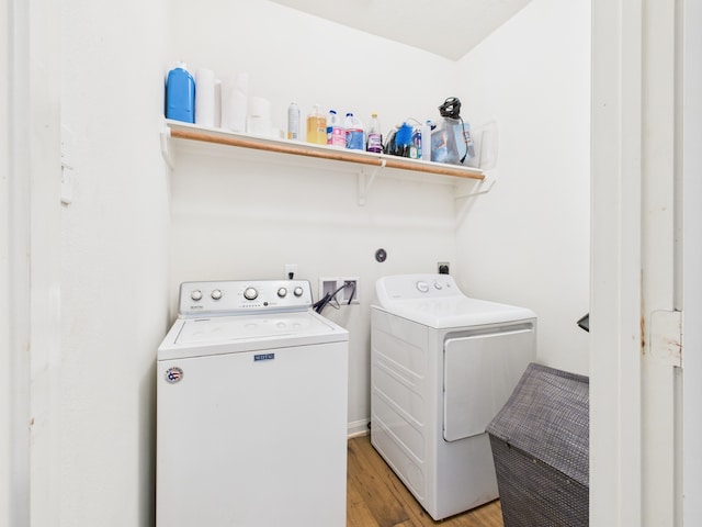 9439 Amethyst Glen Dr, Rosharon, TX 77583 - laundry room with washer and clothes dryer and light wood-style flooring