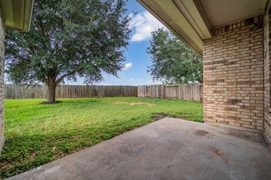 20607 Dademount Ct, Richmond, TX 77407 - fenced backyard featuring a patio area