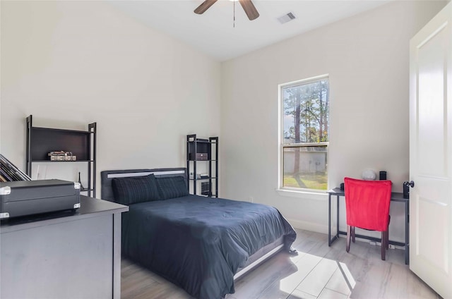 25142 W Tara Plantation Dr, Tomball, TX 77375 - bedroom featuring wood finished floors and a ceiling fan