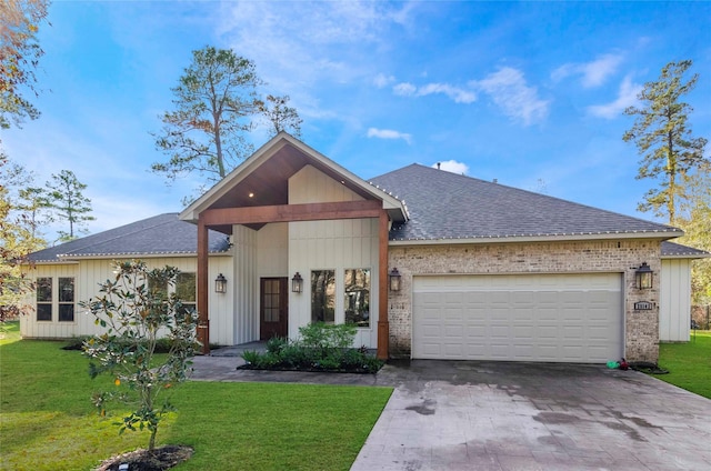 25142 W Tara Plantation Dr, Tomball, TX 77375 - view of front of property featuring a shingled roof, a garage, driveway, a front lawn, and brick siding