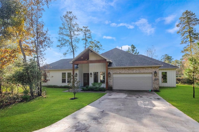 25142 W Tara Plantation Dr, Tomball, TX 77375 - view of front of house featuring an attached garage, a front yard, driveway, and roof with shingles