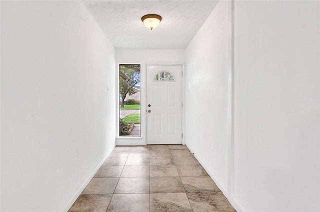 2730 Mesquite Dr, Sugar Land, TX 77479 - entryway featuring baseboards and a textured ceiling