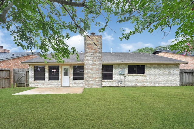 2730 Mesquite Dr, Sugar Land, TX 77479 - rear view of house with a patio, a fenced backyard, a chimney, a gate, and a shingled roof