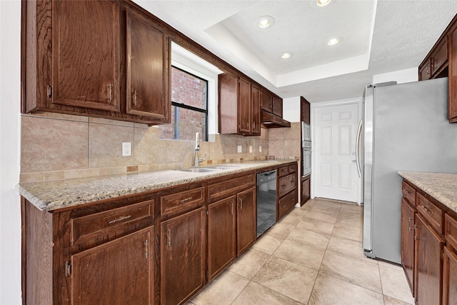 2730 Mesquite Dr, Sugar Land, TX 77479 - kitchen featuring stainless steel appliances, decorative backsplash, light tile patterned floors, recessed lighting, and under cabinet range hood