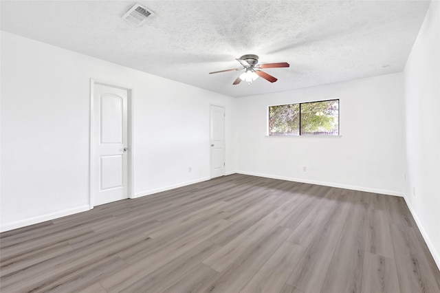 2730 Mesquite Dr, Sugar Land, TX 77479 - spare room with a ceiling fan, a textured ceiling, and wood finished floors