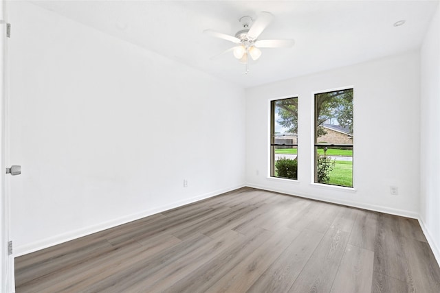 2730 Mesquite Dr, Sugar Land, TX 77479 - unfurnished room with wood finished floors and a ceiling fan