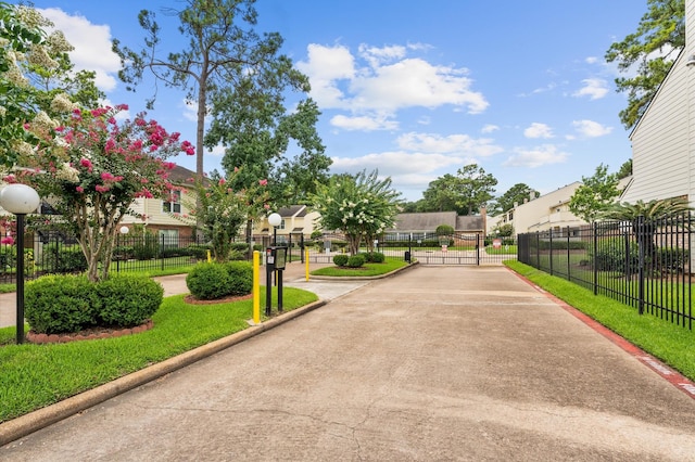 14555 Wunderlich Dr Unit 2602, Houston, TX 77069 - view of home's community featuring a gate and a residential view