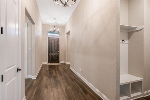 23 N Wheatleigh Dr, Tomball, TX 77375 - entryway with a chandelier and dark wood finished floors