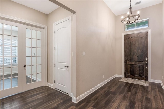 23 N Wheatleigh Dr, Tomball, TX 77375 - foyer featuring a chandelier, dark wood-type flooring, and french doors