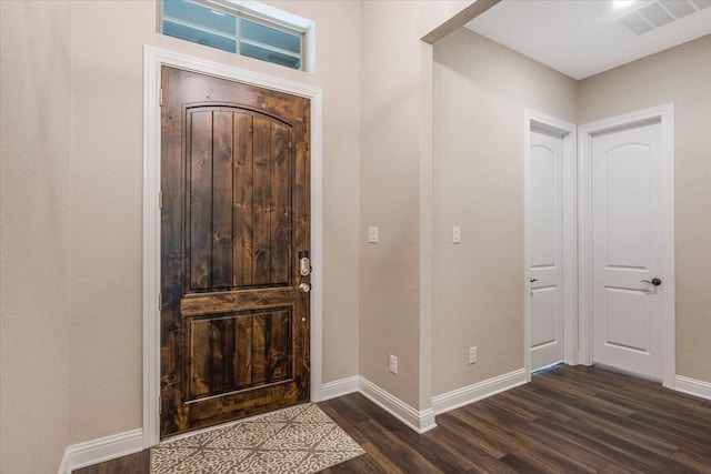 23 N Wheatleigh Dr, Tomball, TX 77375 - foyer entrance featuring dark wood finished floors and baseboards