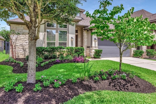 23 N Wheatleigh Dr, Tomball, TX 77375 - view of front of house featuring stone siding, driveway, a garage, a shingled roof, and a front lawn