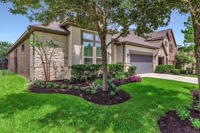 23 N Wheatleigh Dr, Tomball, TX 77375 - view of front of house featuring stone siding, stucco siding, an attached garage, concrete driveway, and a shingled roof