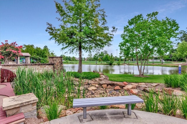 23 N Wheatleigh Dr, Tomball, TX 77375 - view of patio / terrace with a water view