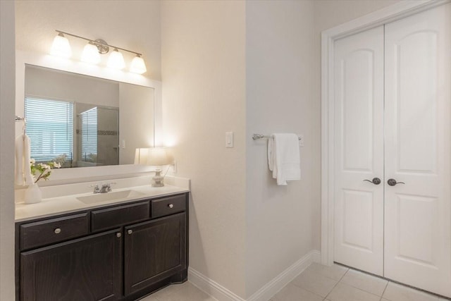 23 N Wheatleigh Dr, Tomball, TX 77375 - bathroom featuring tile patterned flooring, vanity, and a shower