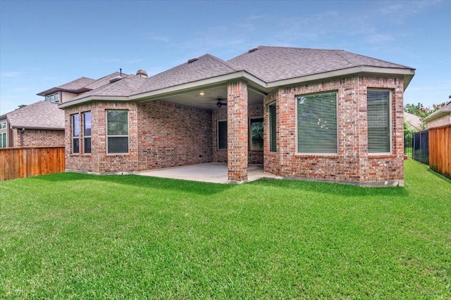 23 N Wheatleigh Dr, Tomball, TX 77375 - back of house with roof with shingles, brick siding, a patio area, and a fenced backyard