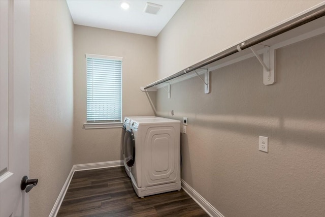 23 N Wheatleigh Dr, Tomball, TX 77375 - laundry room with washer / dryer and dark wood finished floors