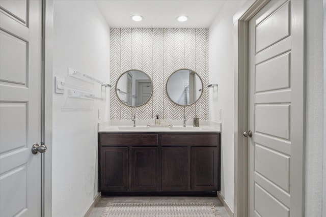 12717 Ermine St, Houston, TX 77047 - full bath featuring double vanity, recessed lighting, and tile patterned floors