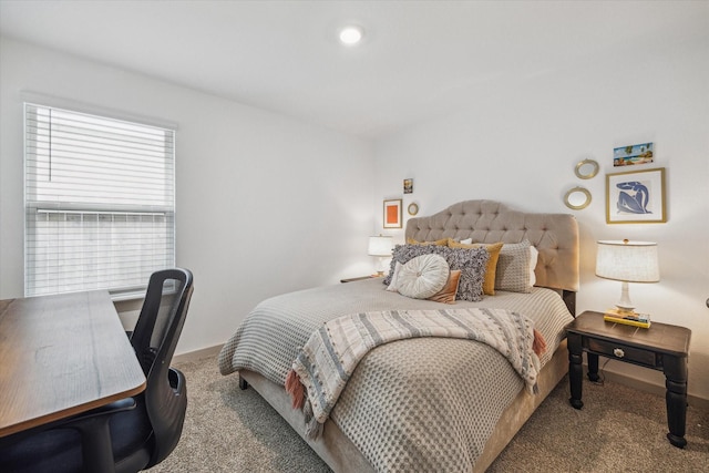 12717 Ermine St, Houston, TX 77047 - carpeted bedroom featuring a desk and baseboards